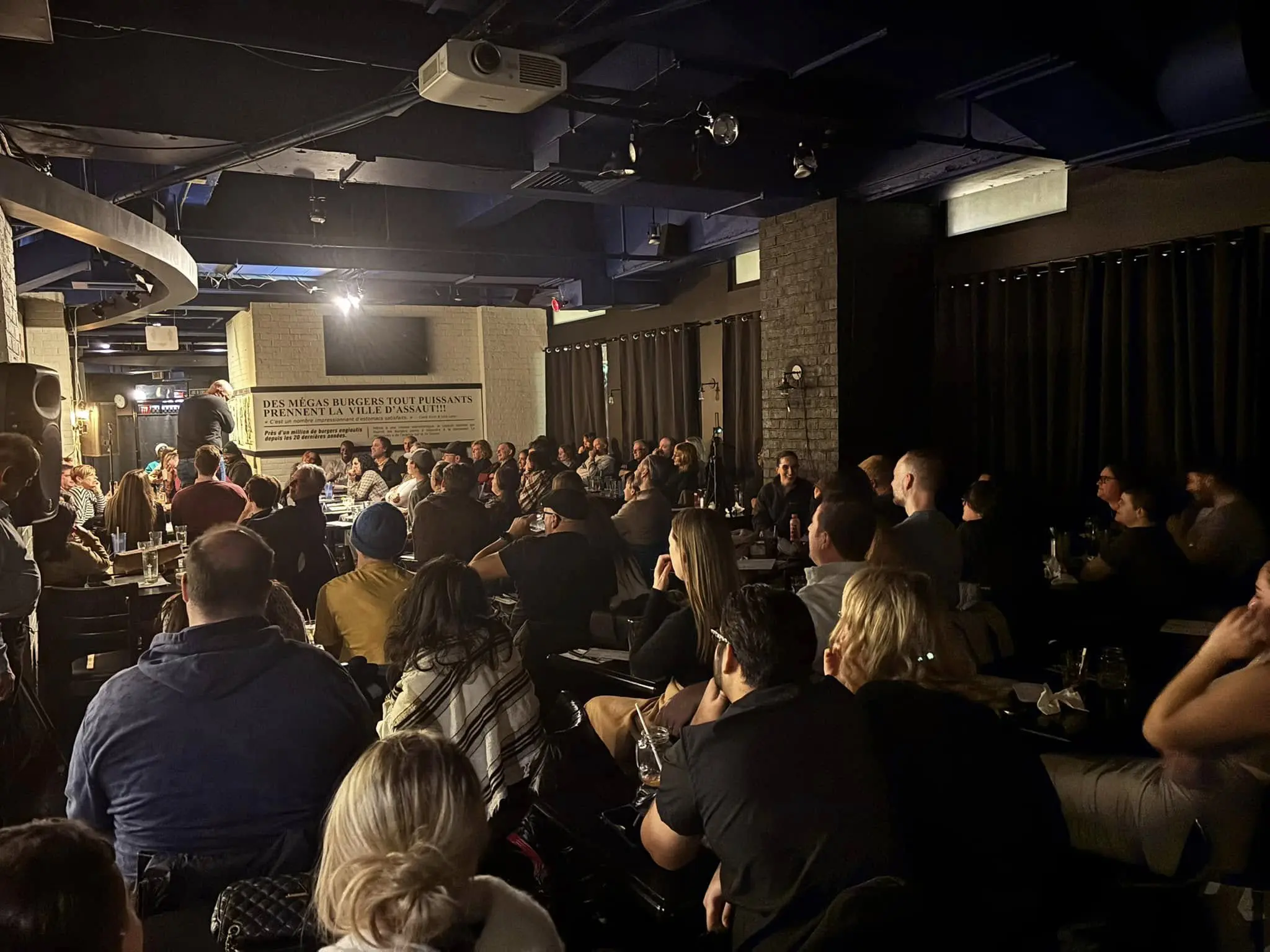 Image20250424143523 A crowd of people sitting in a room.
